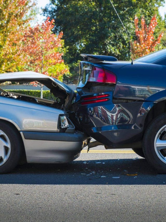 Auto accident involving two cars on a city street