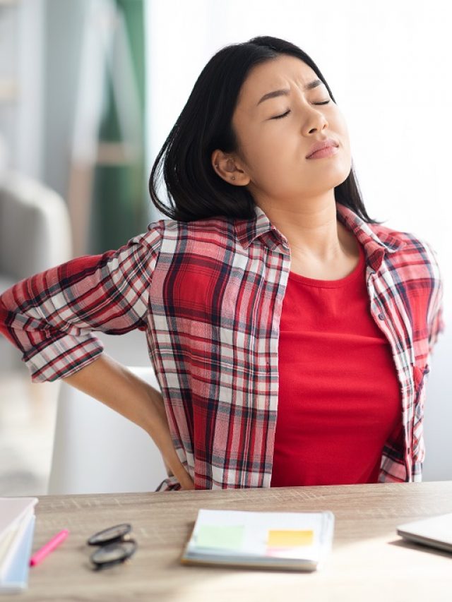 Beautiful Young Asian Woman Suffering From Backache While Working In Home Office