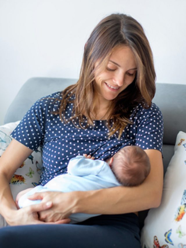 Young,Mother,Breastfeeding,Her,Newborn,Baby,Boy,At,Home