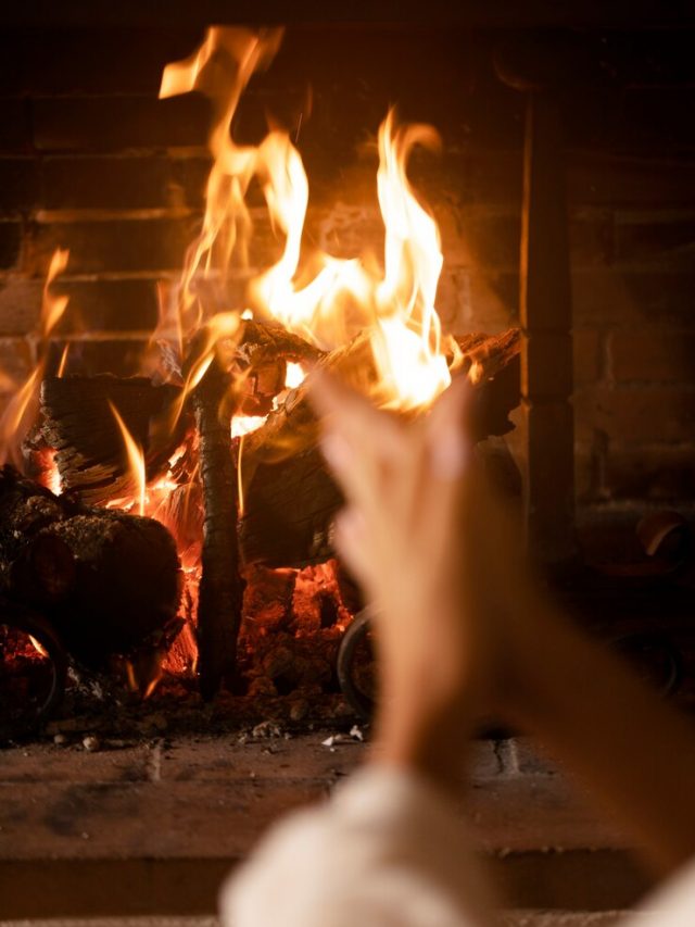 hands-getting-warmer-by-fire-close-up_23-2149172522