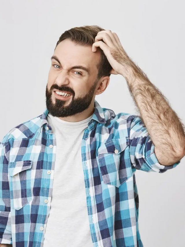 indecisive-bearded-man-standing-clueless-scratching-head-1